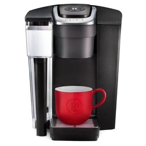 k1500 keurig coffee maker with red mug